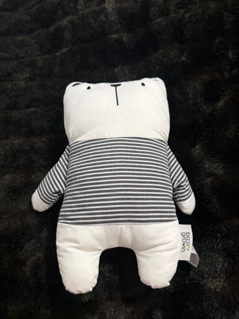 Bizzi Growin bear plush featuring a cute black-and-white striped shirt pattern